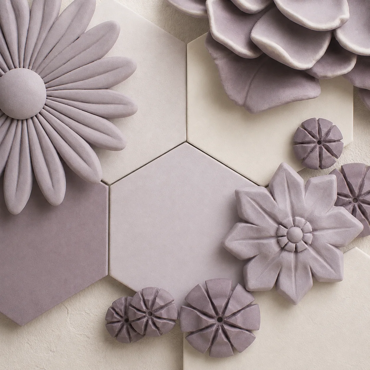 Muted violet and ivory bas-relief surface samples showing material texture and finish by AnaKleo Studio
